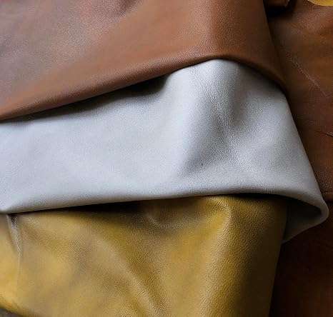White Distressed Crazy Horse Sheepskin Leather Hide, showing folded hides assortment