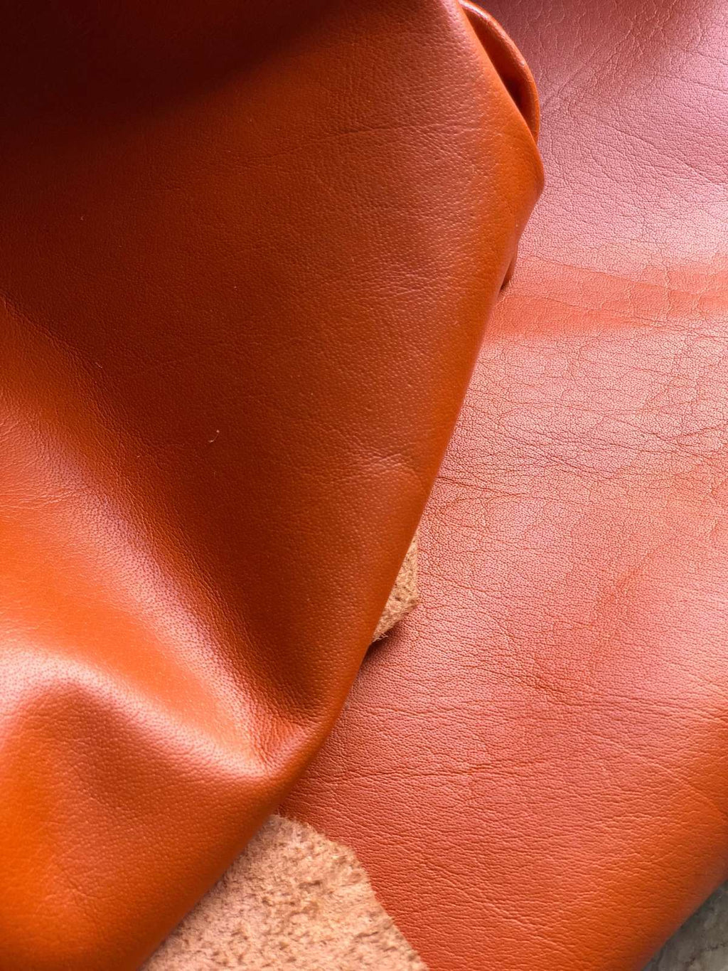 Orange Nappa Sheepskin Leather Hide AA Grade, showing supple drape for craft work