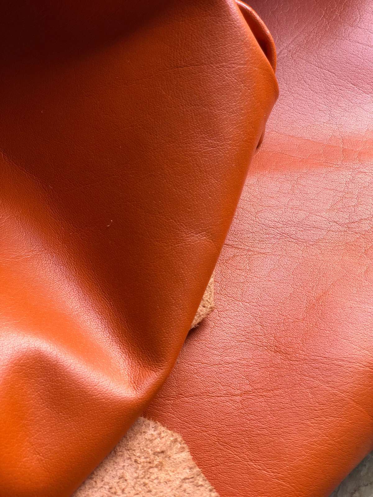 Orange Nappa Sheepskin Leather Hide AA Grade, showing supple drape for craft work