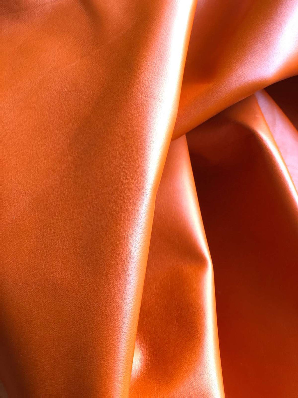 Orange Nappa Sheepskin Leather Hide AA Grade, showing soft folds and smooth finish
