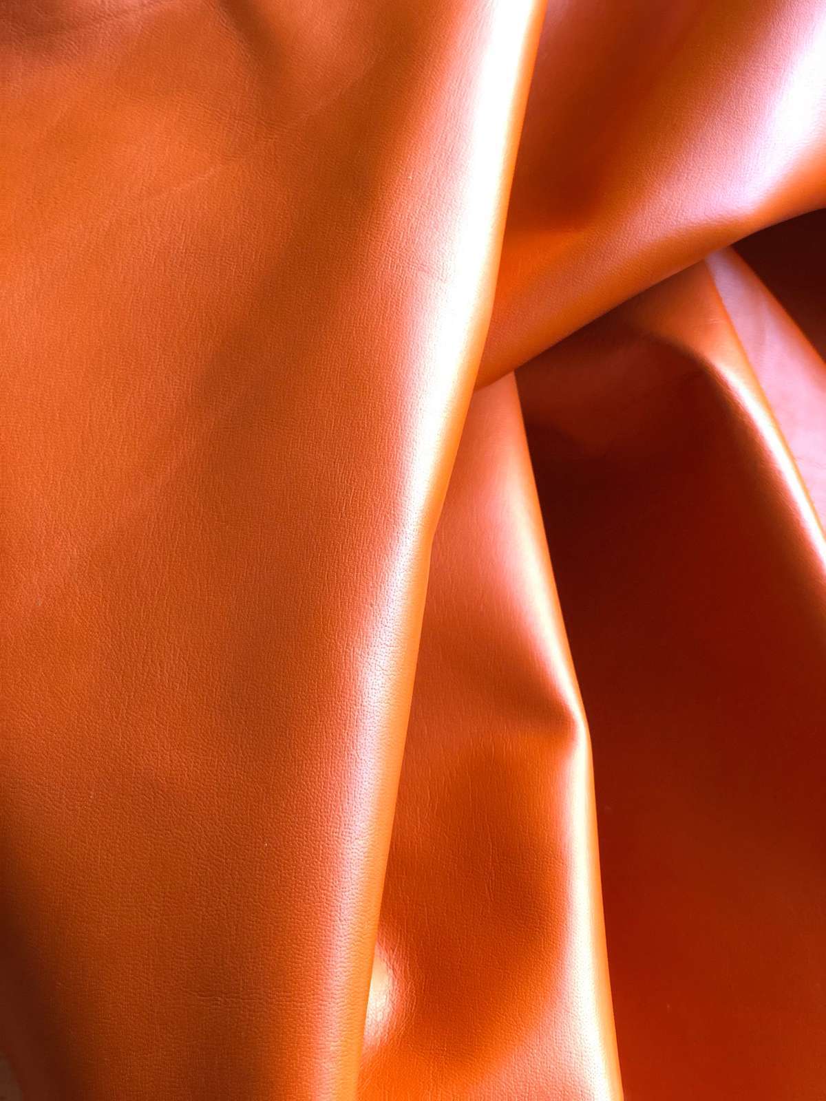 Orange Nappa Sheepskin Leather Hide AA Grade, showing soft folds and smooth finish