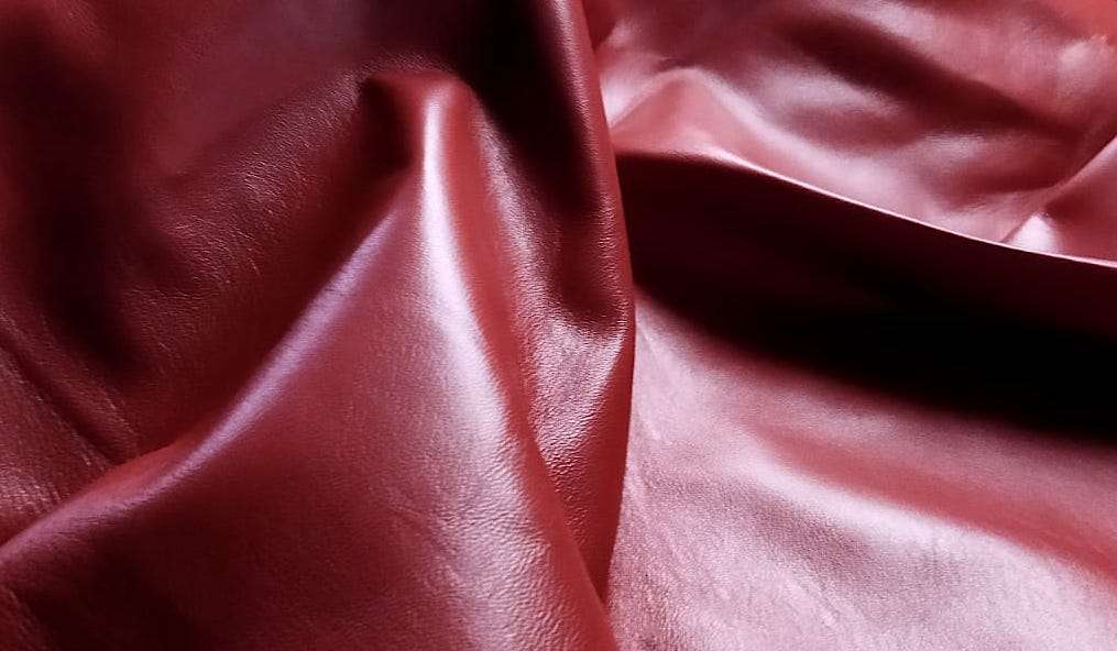 Red Nappa Sheepskin Leather Hide AA Grade, showing smooth surface texture close-up