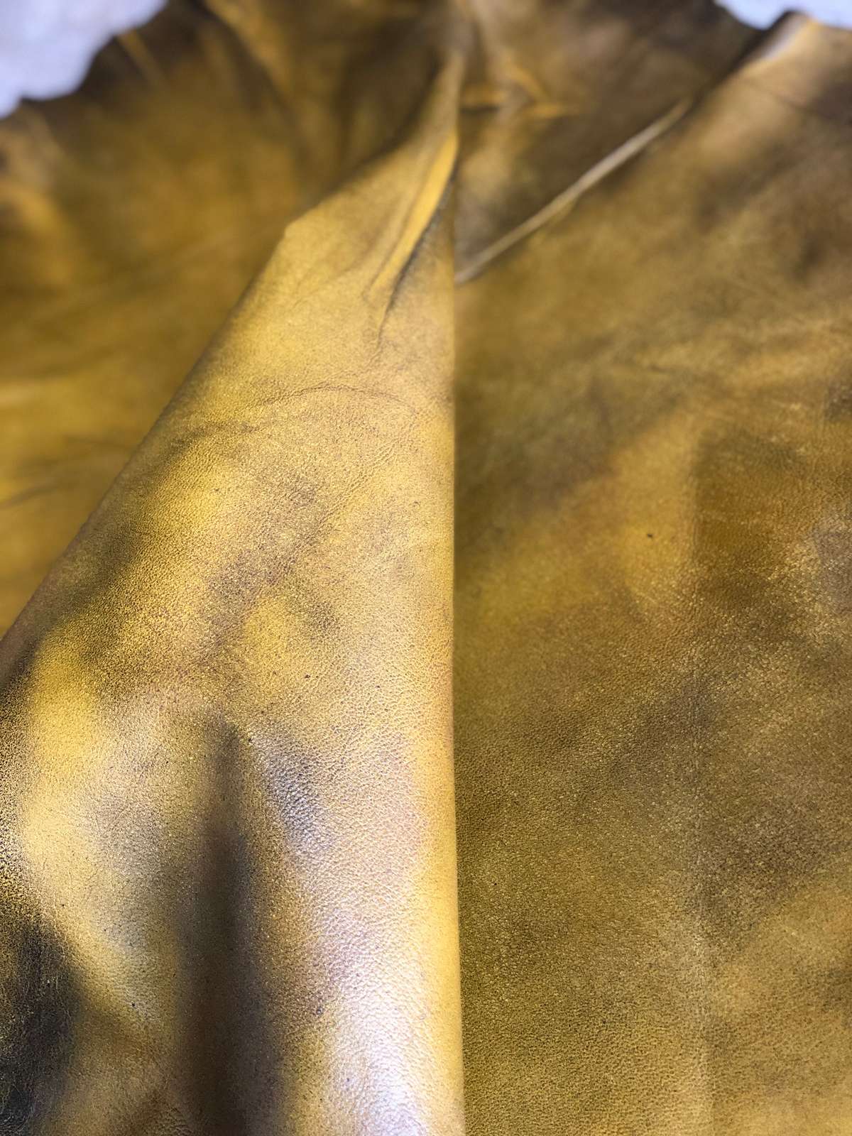 Yellow Distressed Crazy Horse Sheepskin Leather Hide, showing full-grain surface texture