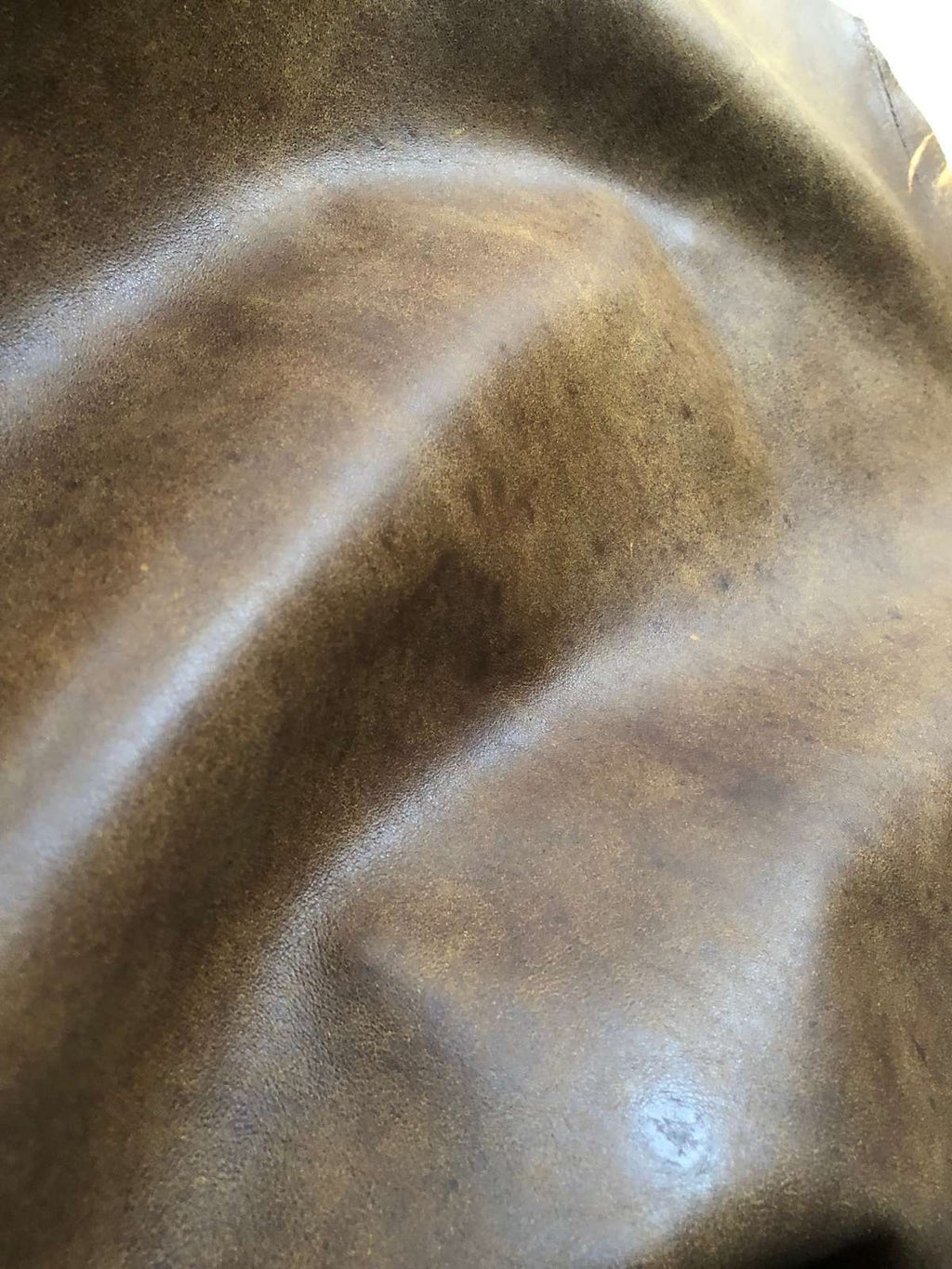 Antique Brown Nappa Sheepskin Leather Hide, showing soft drape and supple folds